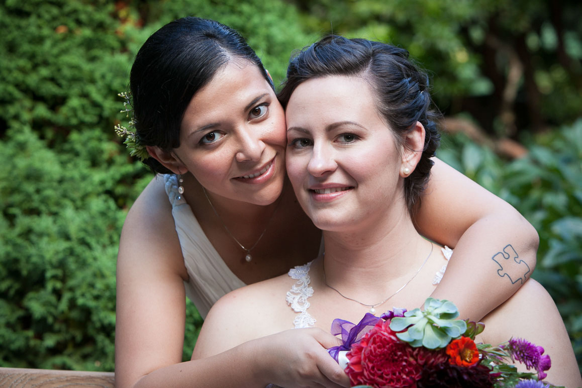 Close up shot of lesbian couple as they hug